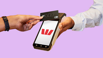 Image of an EFTPOS machine taking a card payment.