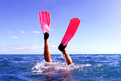 Diver diving in water